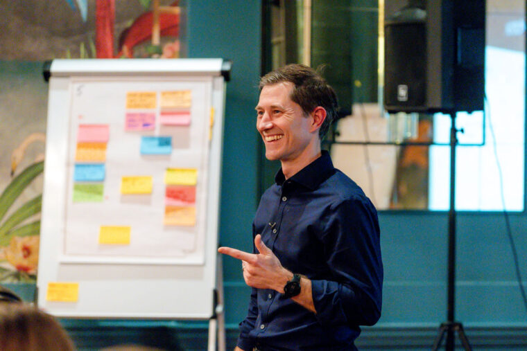 Ben Morton standing by a flipchart